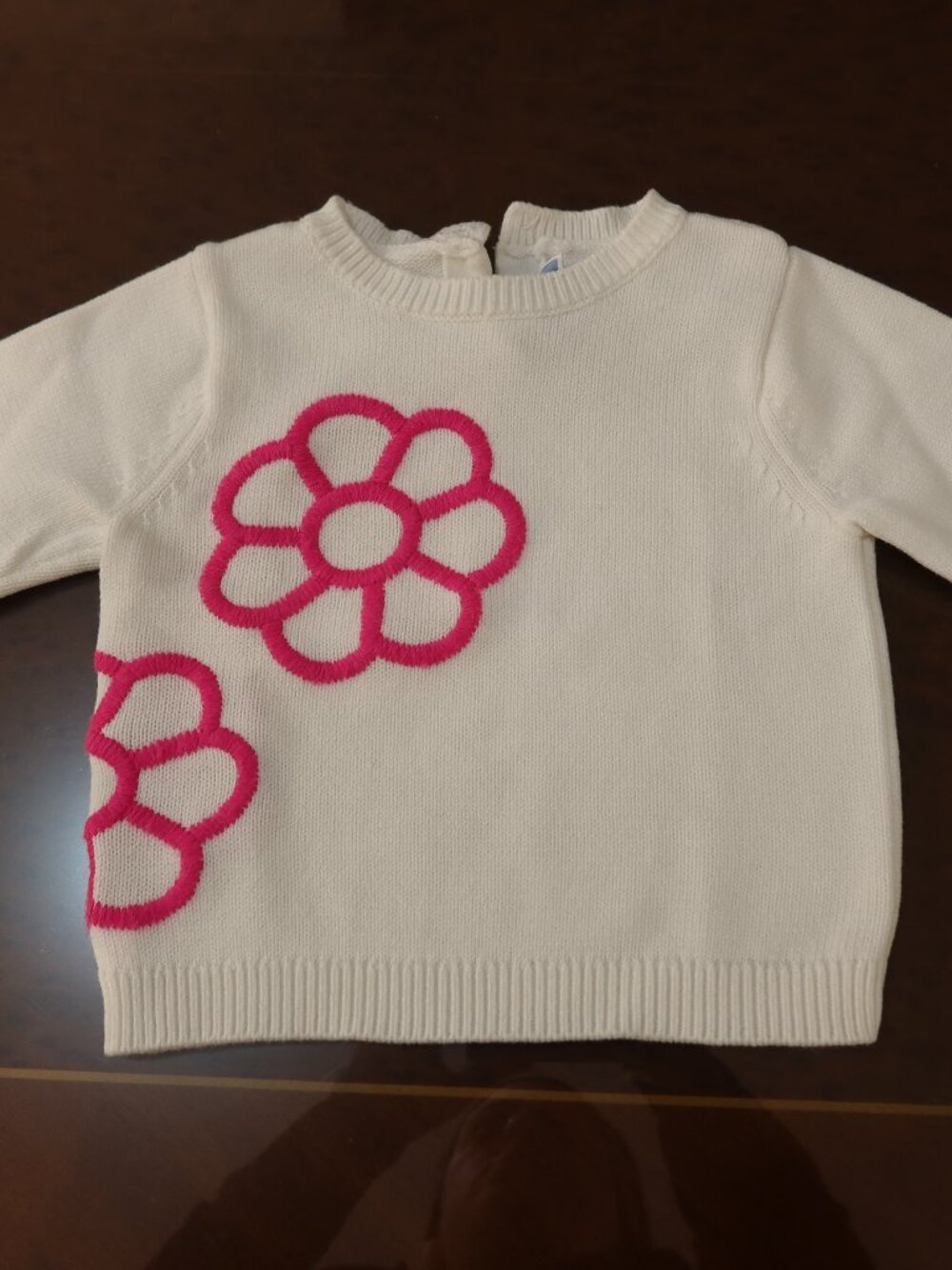 White Jacadi Knit sweater with pink embroidered flower detail. 18 months.
